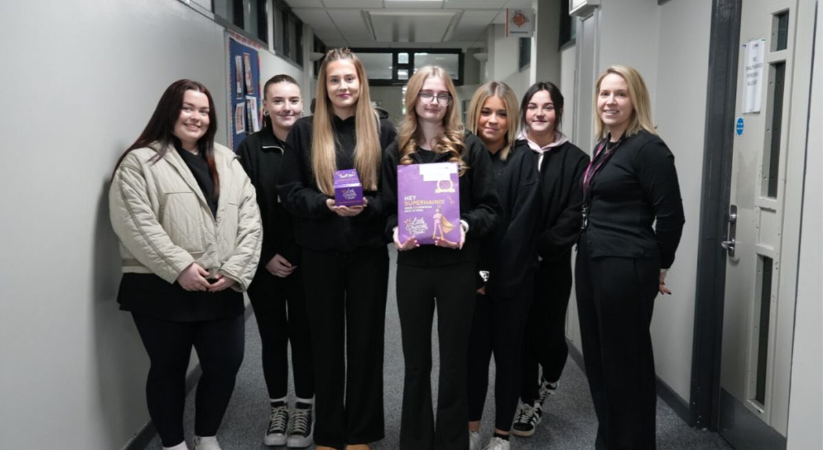 Picture of hairdressing students with their tutor